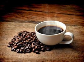 Coffee cup and saucer on a wooden photo