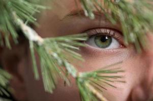 Young Woman With Shadows From Pine Tree On Her Face photo