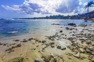 Tropical mexican beach clear water boulders Playa del Carmen Mexico. photo