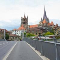 Street view of Lausanne. Ancient buildings and cathedral seen from the bridge. Switzerland photo