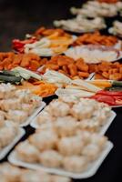 Wedding party buffet with nuggets, canape, sandwiches photo
