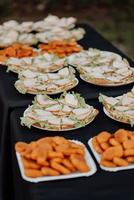 Wedding party buffet with nuggets, canape, sandwiches photo