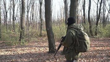 Soldier with rifle in the forest video