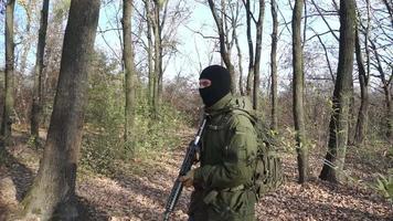 Soldier with rifle in the forest video