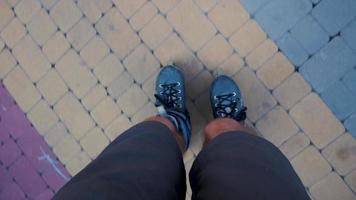 Feet rollerblading from the rollerblader's point of view video