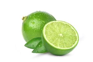 Natural fresh lime with cut in half and water droplets isolated on white background