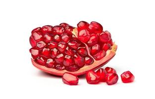 Close-up ripe pomegranate seeds isolated on the white background