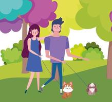 young couple walking with their little dogs in the park vector