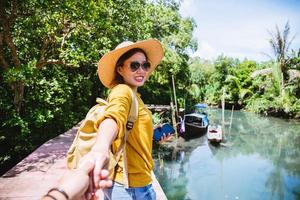 Asian couple holding hands, traveling nature. Travel relax. at tha pom-klong-song-nam. Krabi, in Thailand. Travel Thailand. Honeymoon, romantic. photo