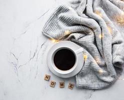 Cup of coffee, scarf and garland photo