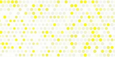 Light yellow vector background with spots.