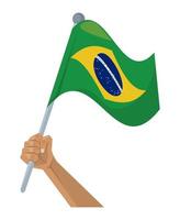 mano con la bandera de brasil vector