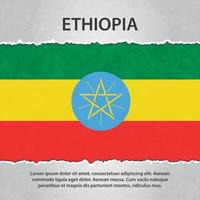 Ethiopia flag on torn paper vector