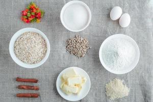 Ingredients for baking oatmeal cookies on a light background photo