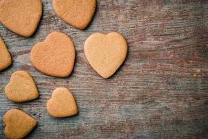 A pattern of ginger biscuits on a gray wooden table. photo