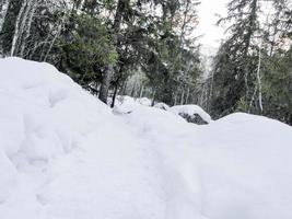 Snowed-in hiking trail to the Rjukandefossen waterfall, Hemsedal, Norway. photo