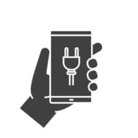 Hand holding smartphone glyph icon. Silhouette symbol. Smart phone charging. Negative space. Vector isolated illustration