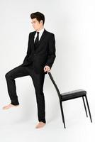 Young businessman with a office chair photo