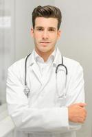 Confident young medical doctor photo