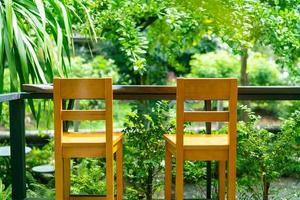 empty wooden bar stool in garden photo