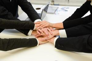 Business team with their hands together photo