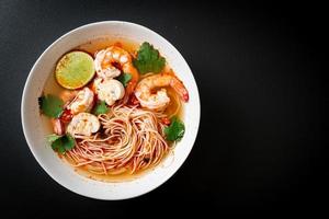 noodles with spicy soup and shrimps - Tom Yum Kung photo