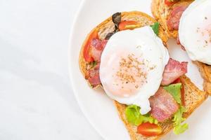 whole wheat bread toasted with vegetable, bacon and egg photo
