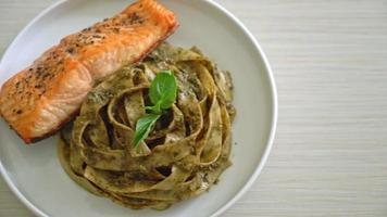 fettuccini spaghetti pasta with pesto sauce and grilled salmon fillet steak video