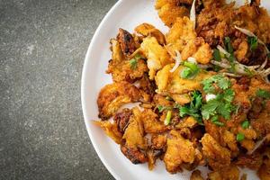 Crispy fried mussel pancake with egg photo