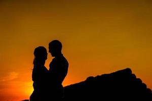 a guy with a girl on a summer walk in the field photo