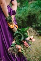 Girl model blonde in a lilac dress with a bouquet photo