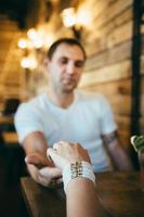 guy and a girl meeting in a city cafe photo