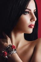 portrait of a brunette girl with red lips photo