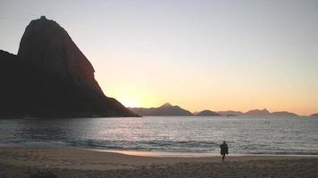 Sunrise on the red beach in Urca in Rio de Janeiro, Brazil
