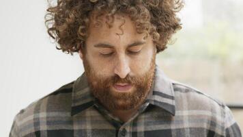 Close up of man looking up into camera lens video