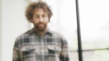 Man looking up with following eyes into camera lens video