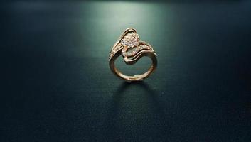Womens gold ring with royal carved motifs photo