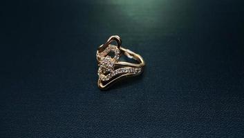 Womens gold ring with royal carved motifs photo