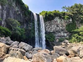 The high waterfall Jeongbang in Jeju island. South Korea photo