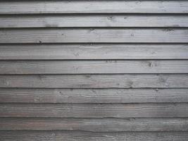 Horizontal wooden boards brown on the wall as a background texture photo