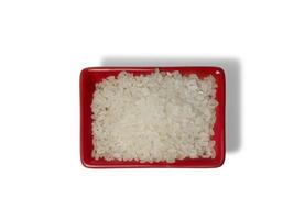 Rice in a red rectangular saucer isolated on white background. The view from above photo