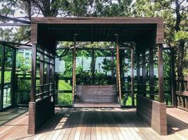 Wooden swings in a garden. Front view. Jeju island
