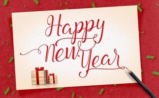 Feliz año nuevo palabra en antiguo arte de papel vintage con presente y lápiz sobre papel artesanal rojo foto