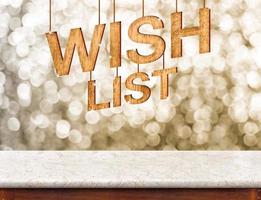 Wish list wood texture with sparkle star hang on marble table with sparkling gold bokeh wall photo