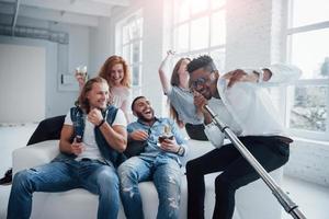 If only this stick was a real microphone. Friends decides to relax by singing their favourite songs photo