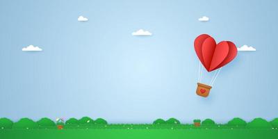 red folded heart hot air balloon flying over grass, paper art style