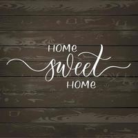 Home sweet home - hand lettering inscription on wood background. vector