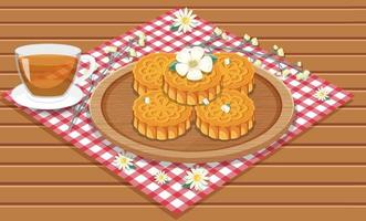 Pile of mooncakes with teacup set on wooden table vector