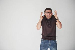 What have I done. The emotional person in casual clothes and in glasses looks as the irreparable mistake is made photo