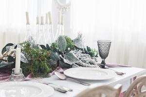 Table served for Christmas dinner in living room, close up view photo